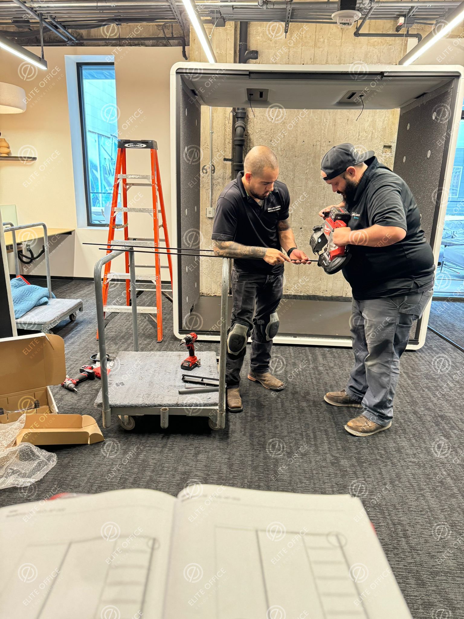 Elite Office Renovation worker completing a commercial office renovation project