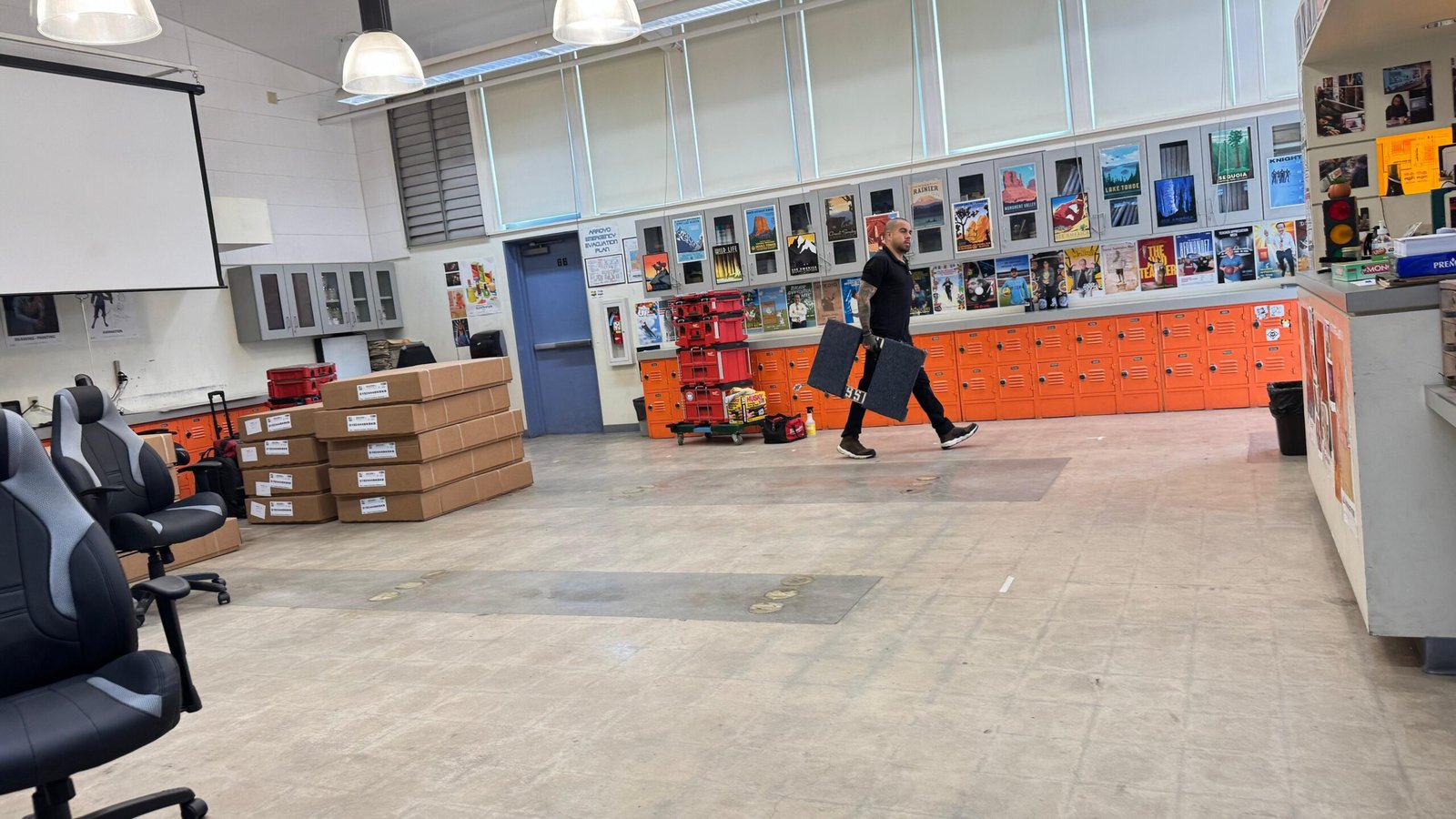 School furniture cartons and components staged inside a classroom before installation